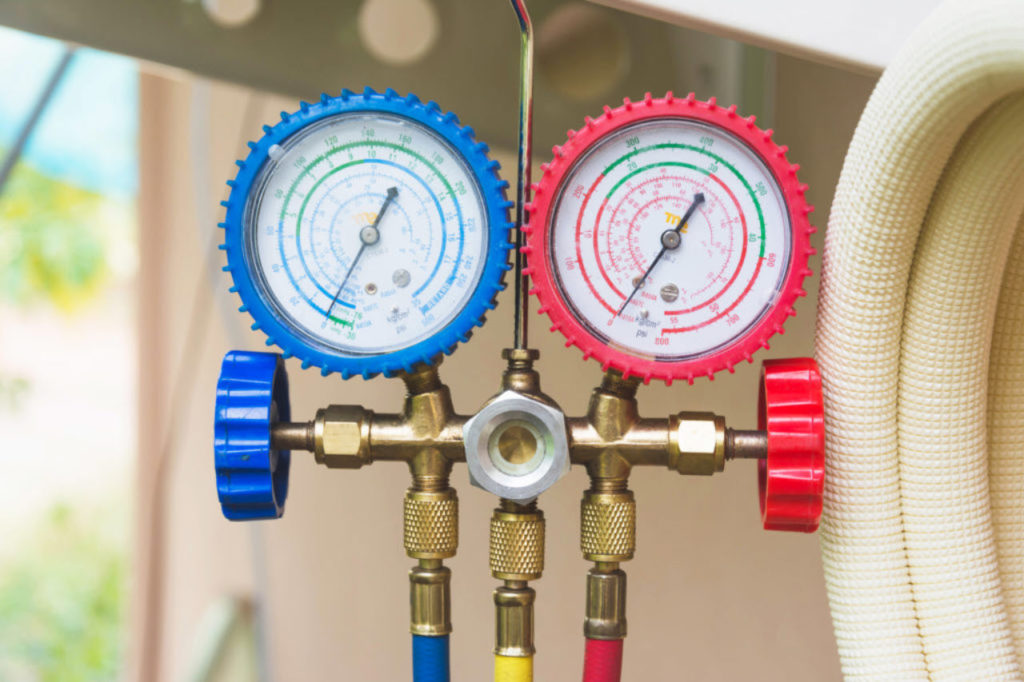 Closeup of a pressure meter on air conditioner